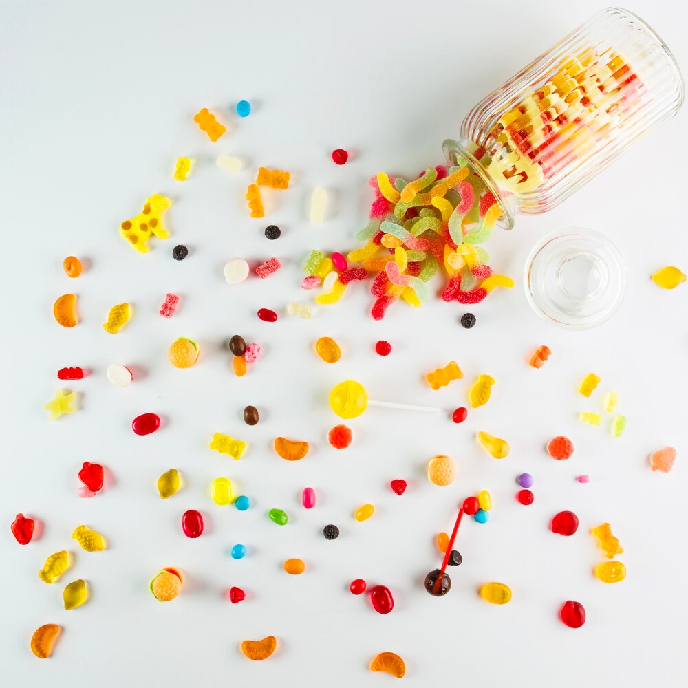 Bunch of sweets near jar