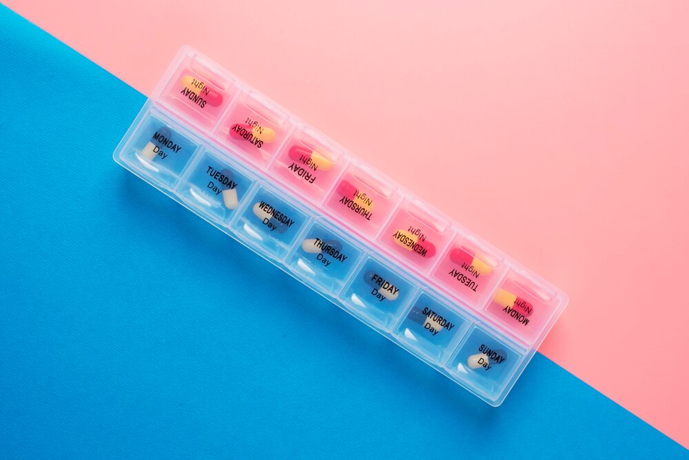 Flat lay pill box arrangement