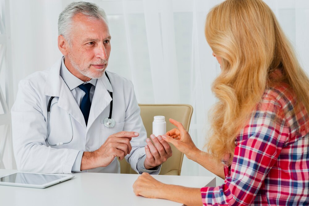 Doctor handing medication to patient